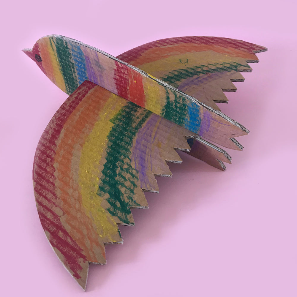 cardboard bird craft project with rainbow wings