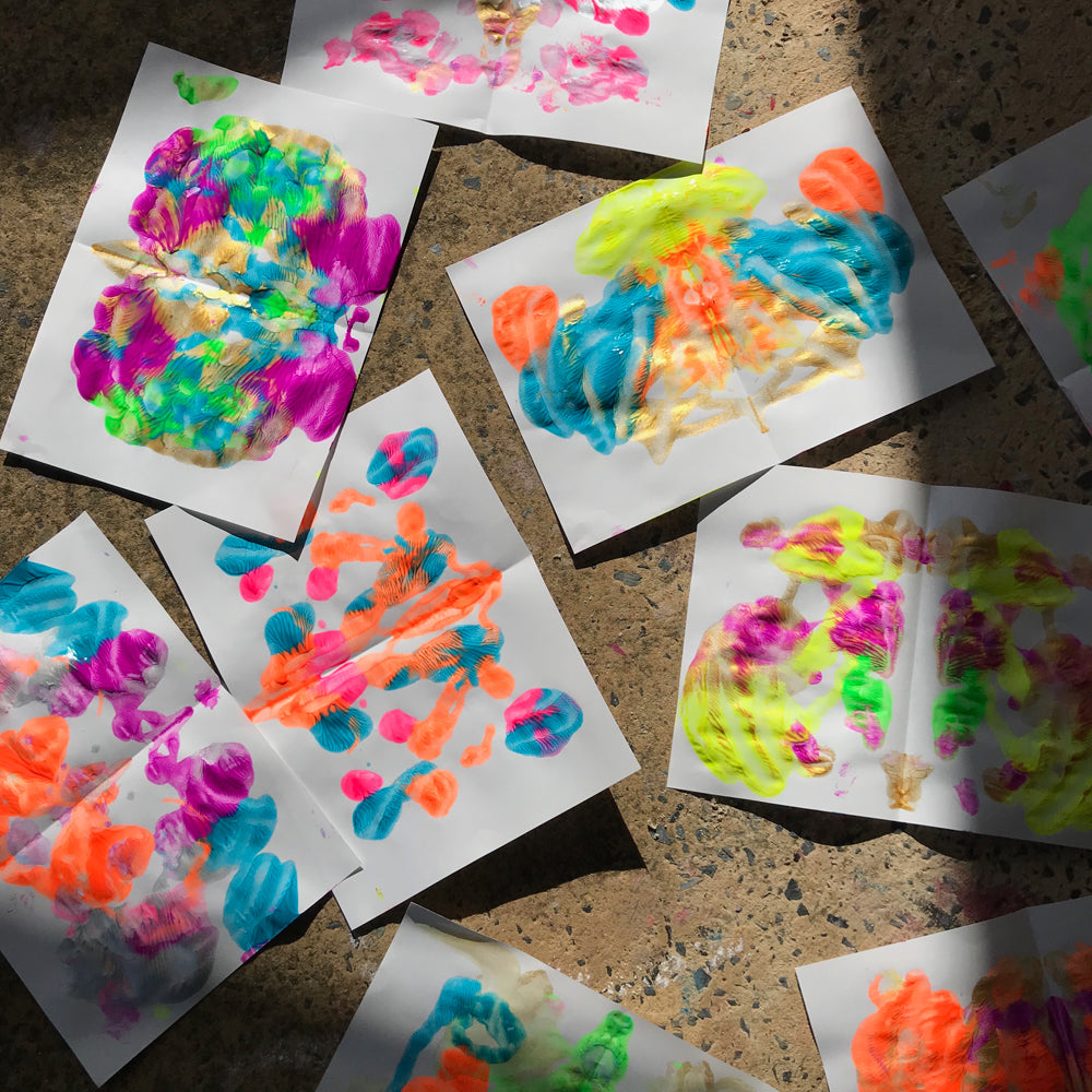 Squashed paint butterflies kids process art