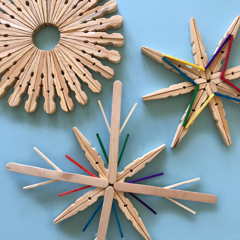 Pretty wooden Christmas snowflakes made from clothes pegs