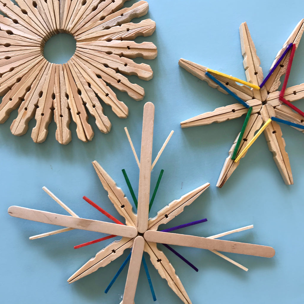 Pretty wooden Christmas snowflakes made from clothes pegs