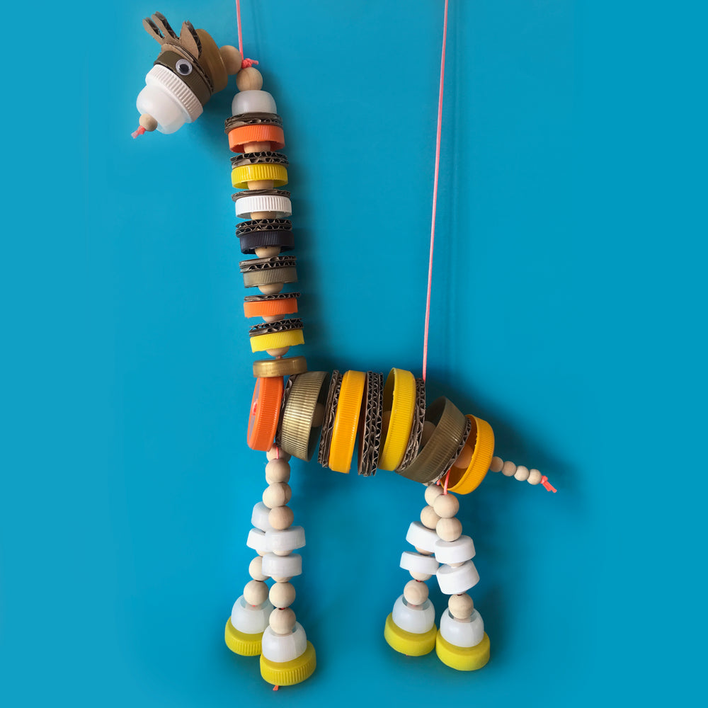 up-cycled bottle top giraffe marionette