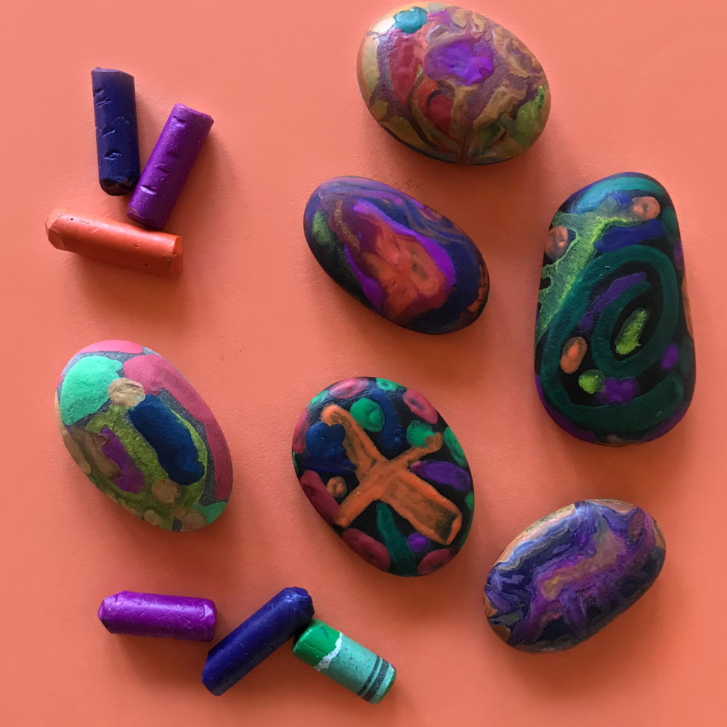 Decorated rocks using melted wax crayons