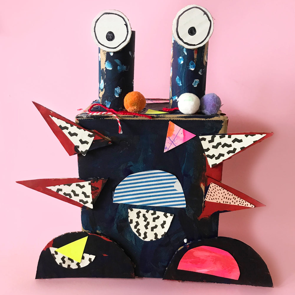 monster made from cardboard boxes and recycling