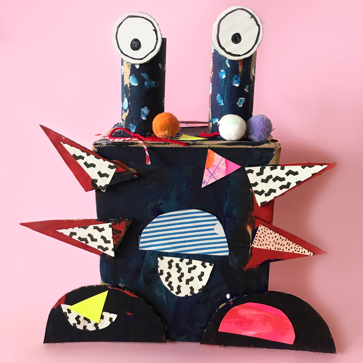 monster made from cardboard boxes and recycling