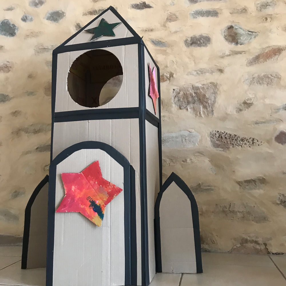 Cardboard box kids play rocket